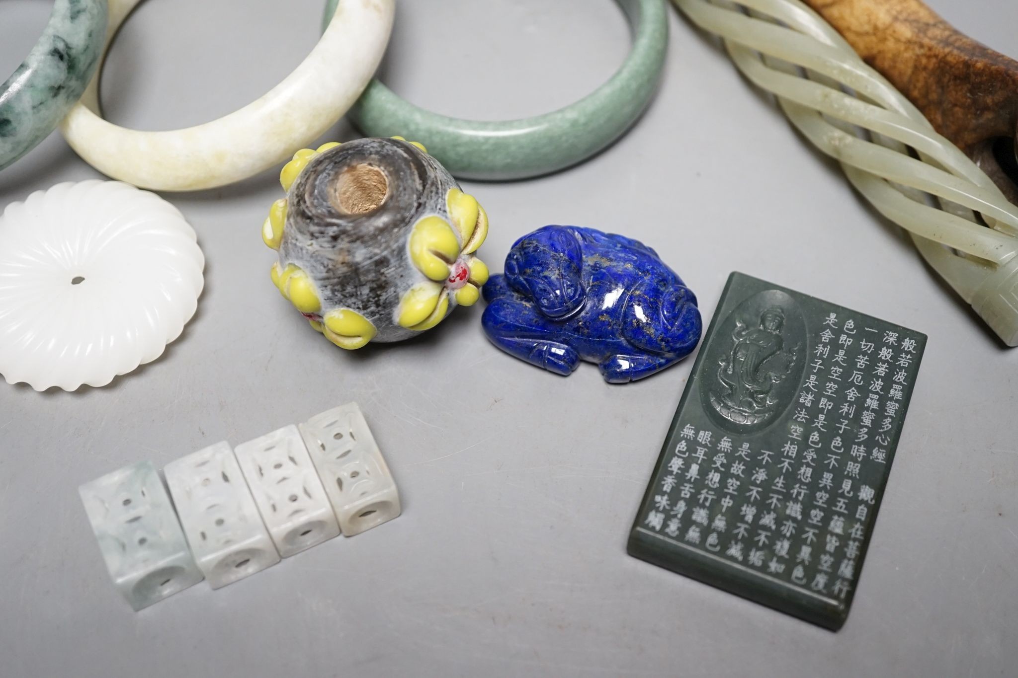 A group of Chinese carvings, including three bangles